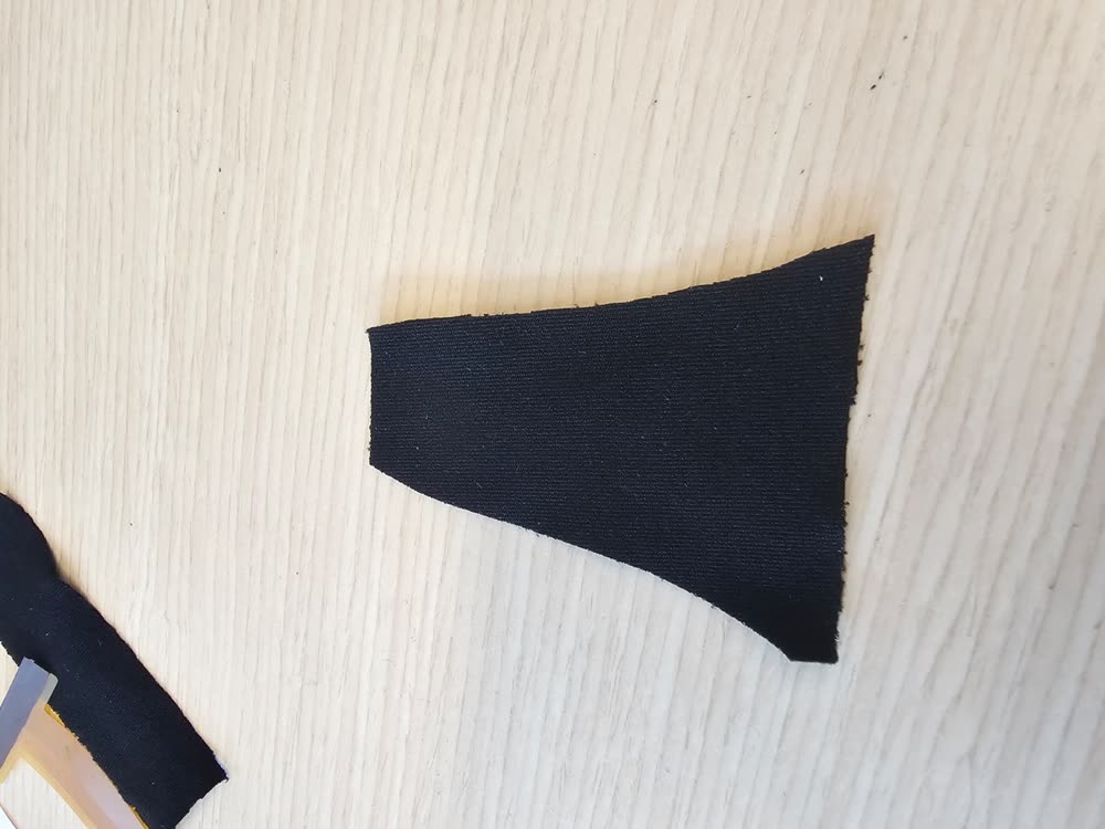 The piezoresistive fabric cut to the shape of the sensing area.
