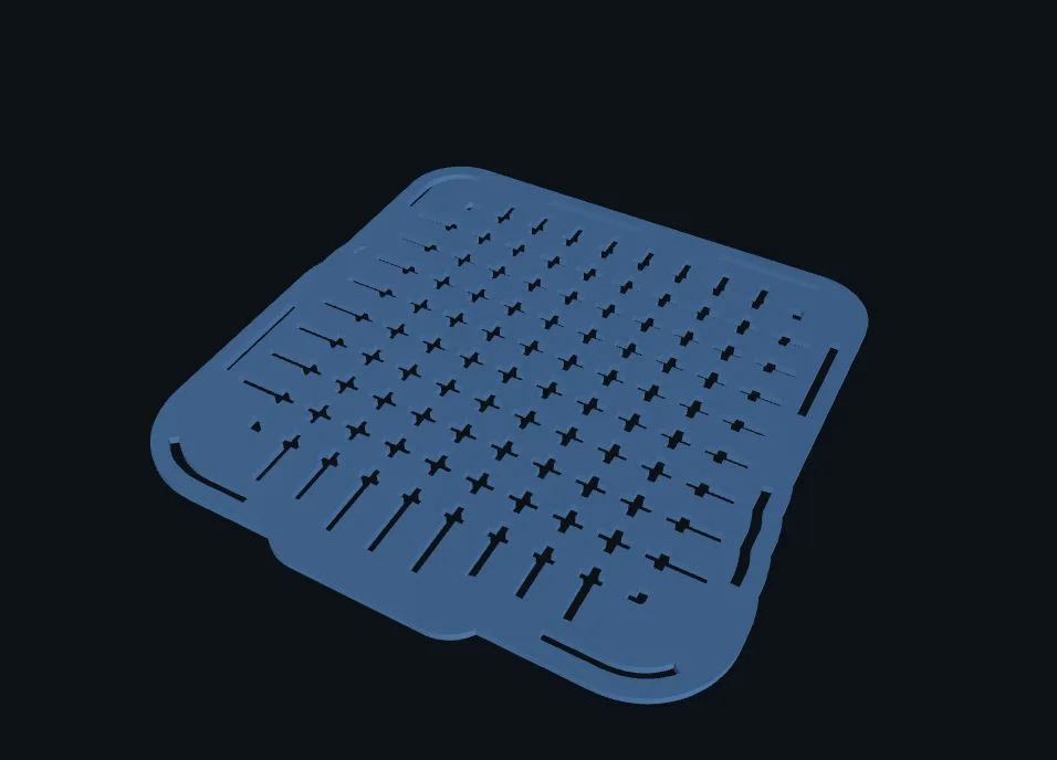 The hatched lid: cross-shaped cuts between the taxels, small tabs holding it together.